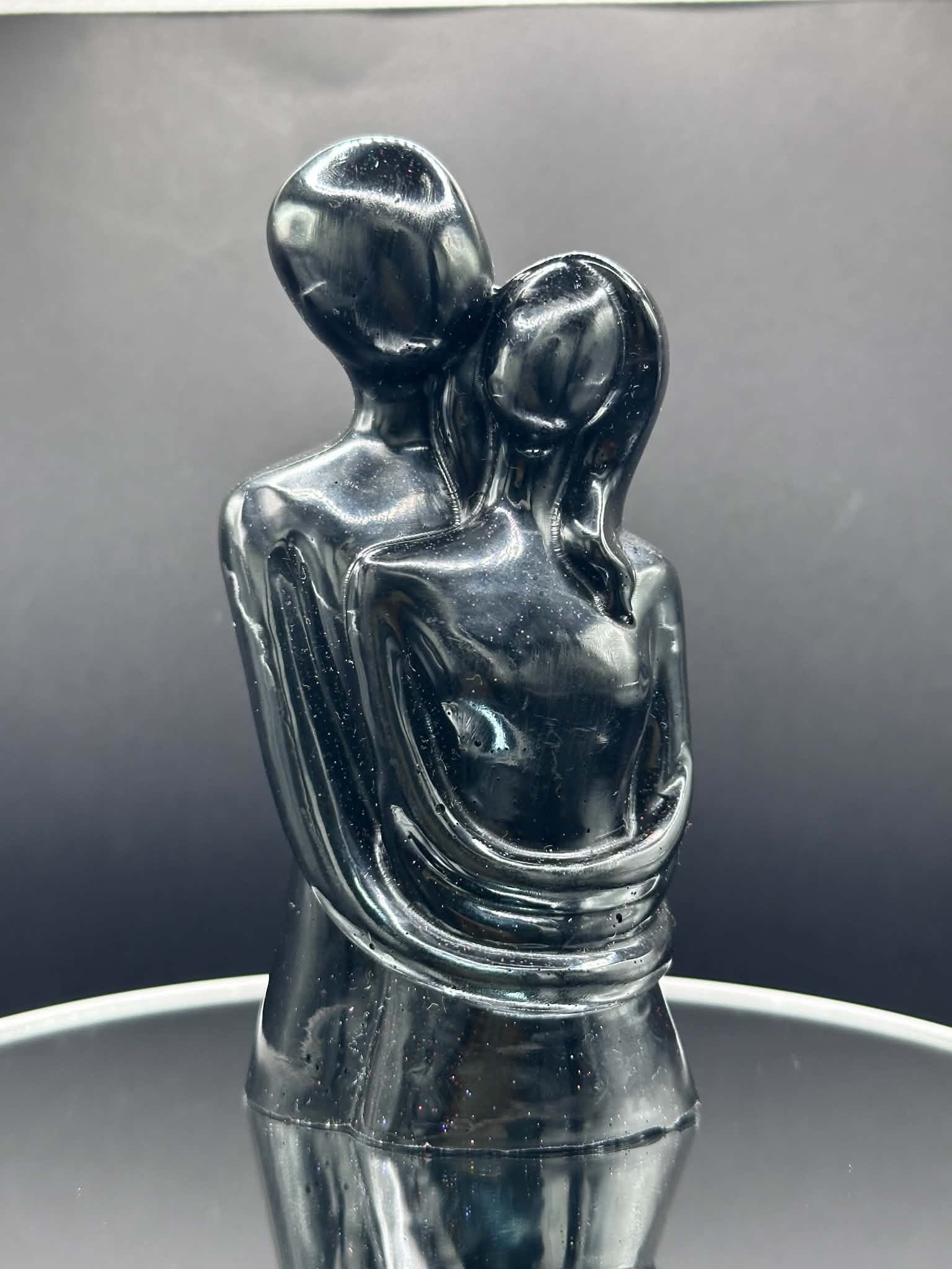 Man and Woman Embrace Figurine in Black