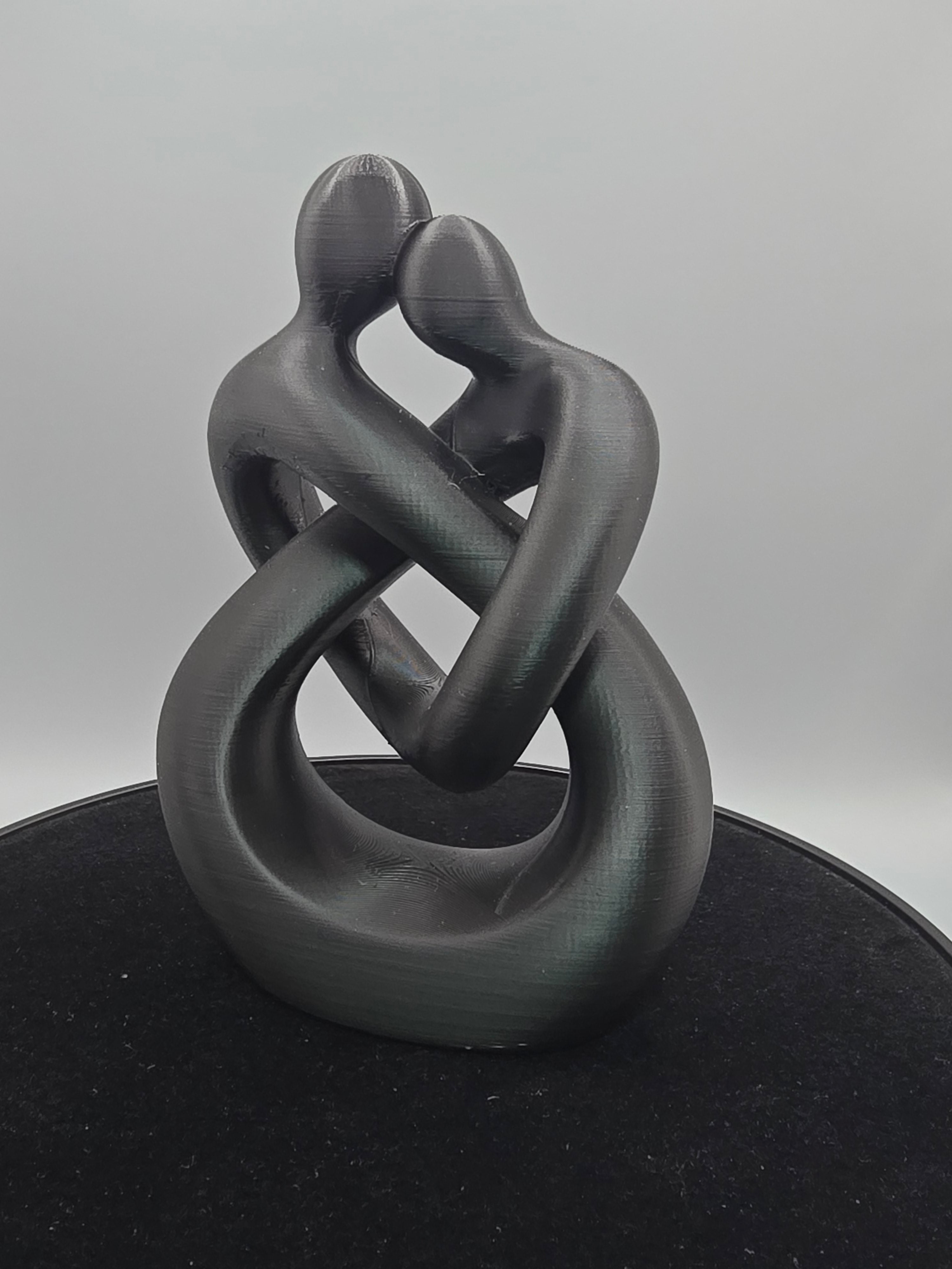 Intertwined Man And Woman In Black