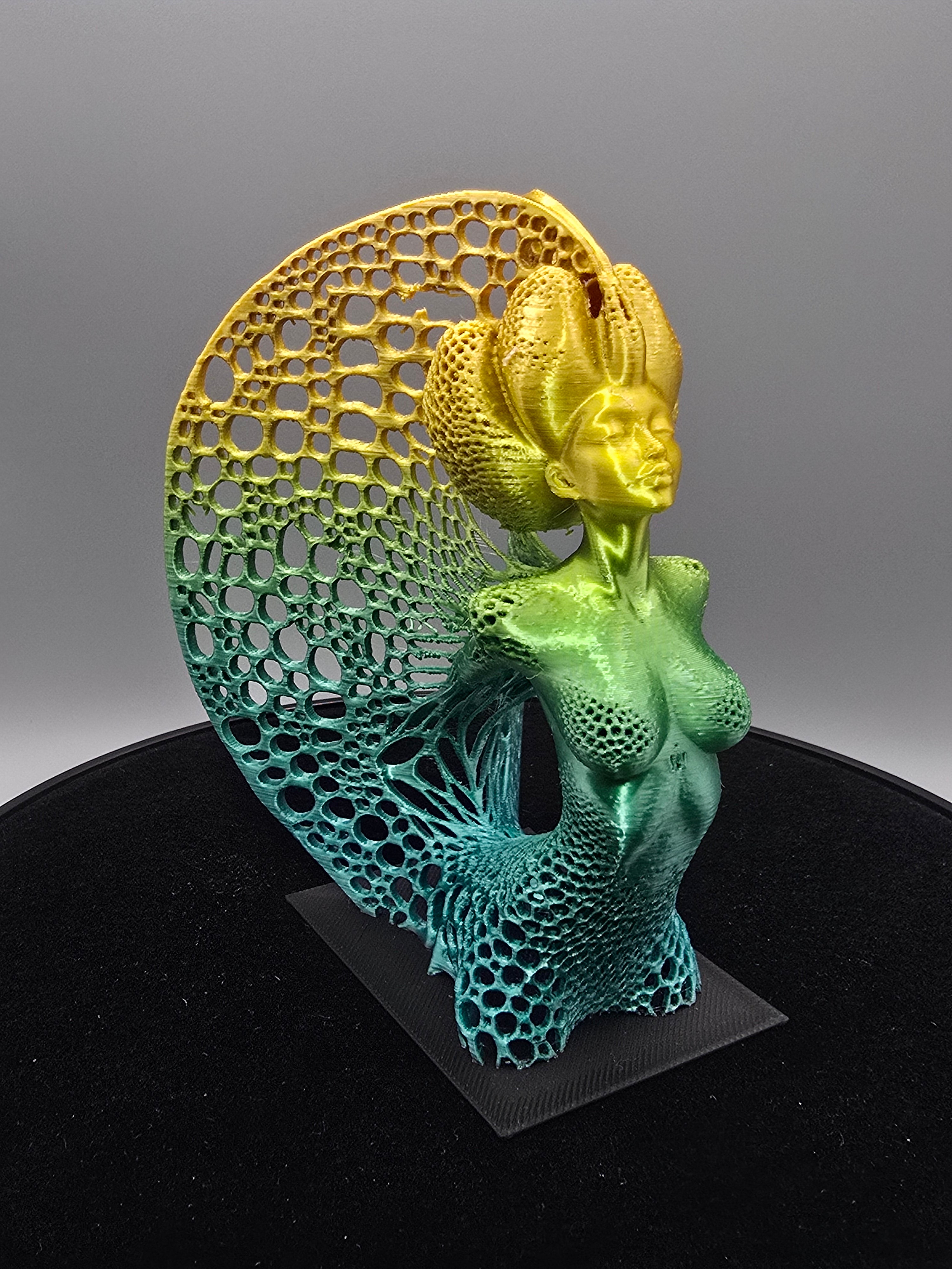 Multicolored Woman Statue With Wings