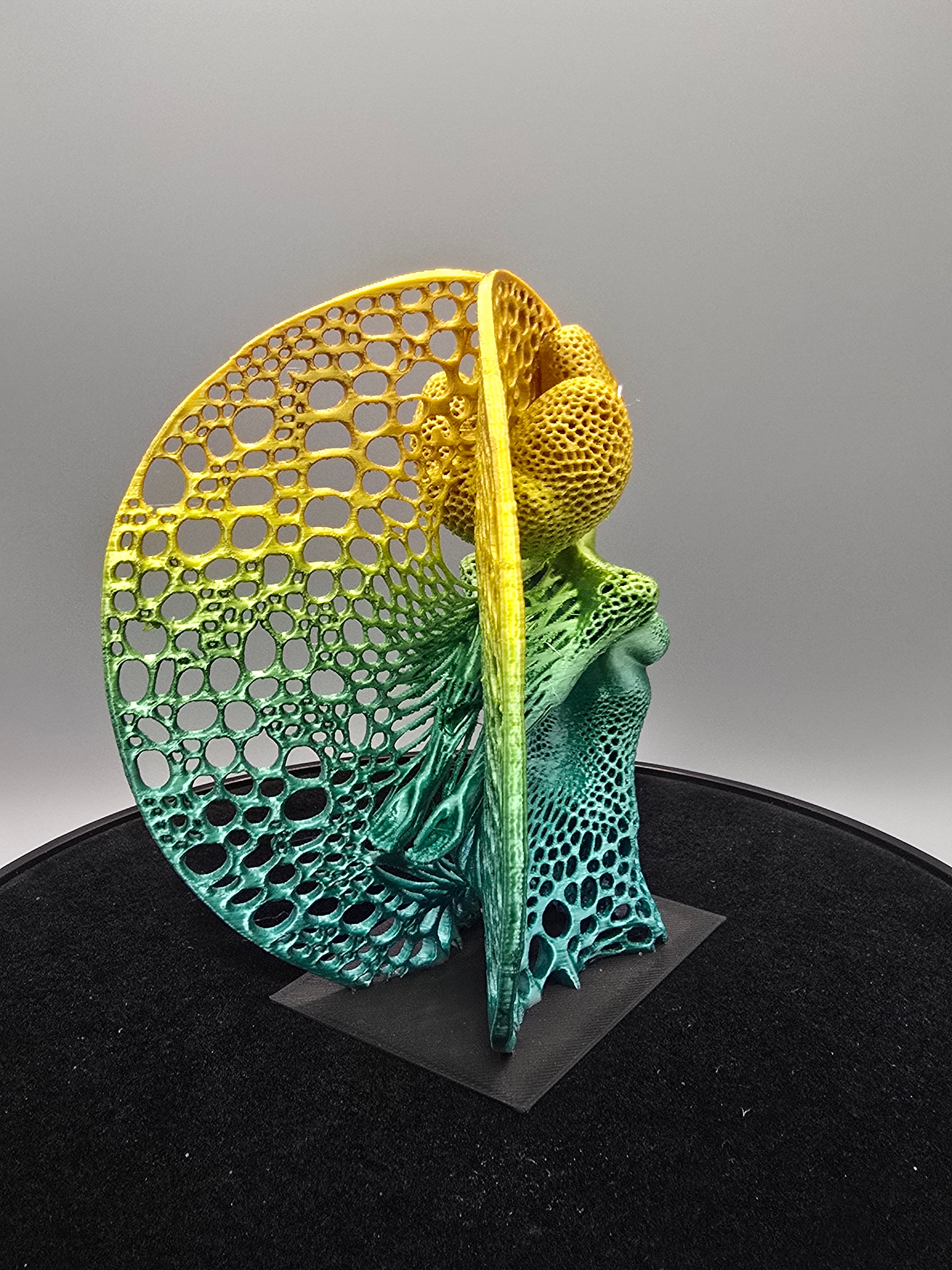 Multicolored Woman Statue With Wings
