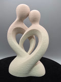 Intertwined Man And Woman In Beige