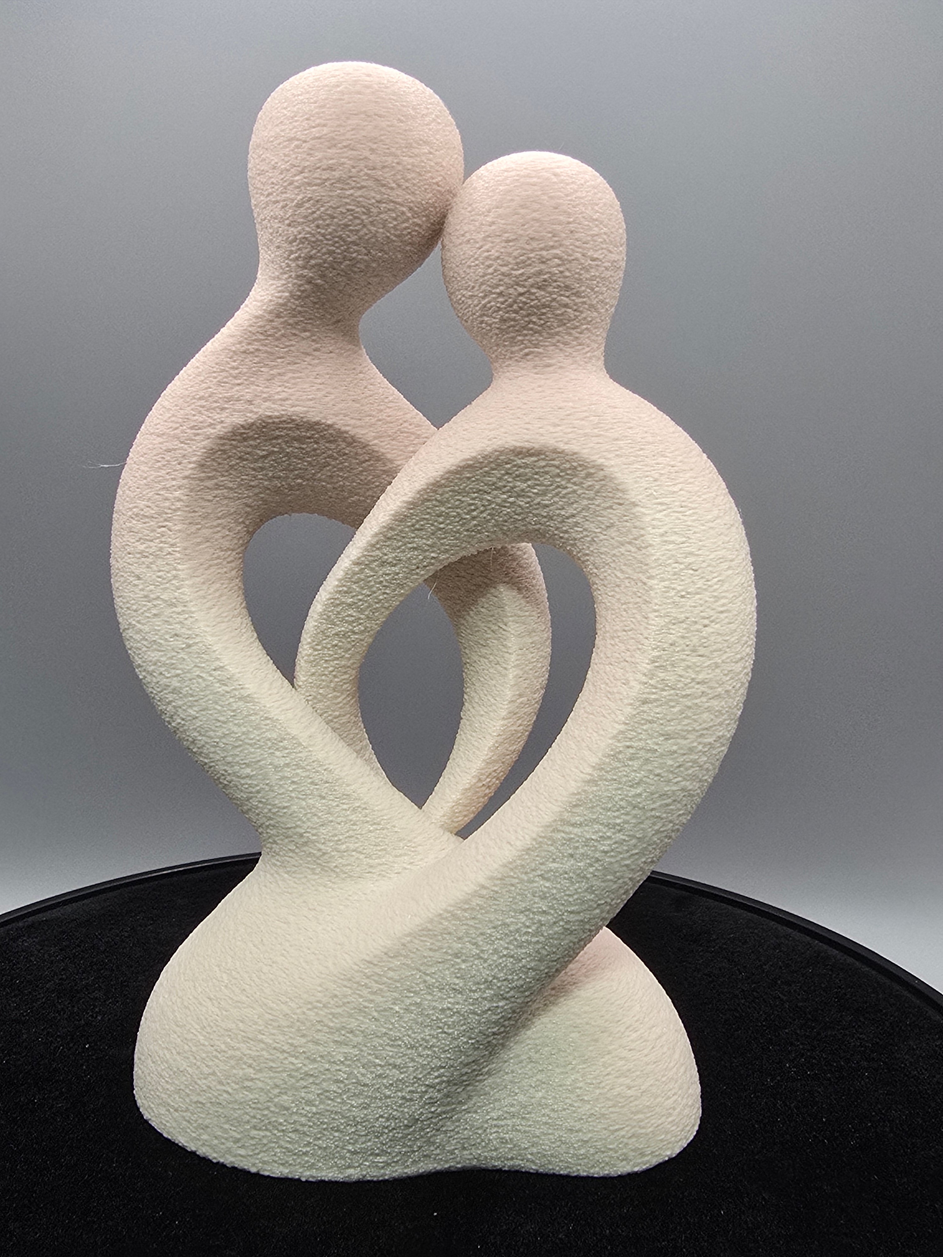 Intertwined Man And Woman In Beige