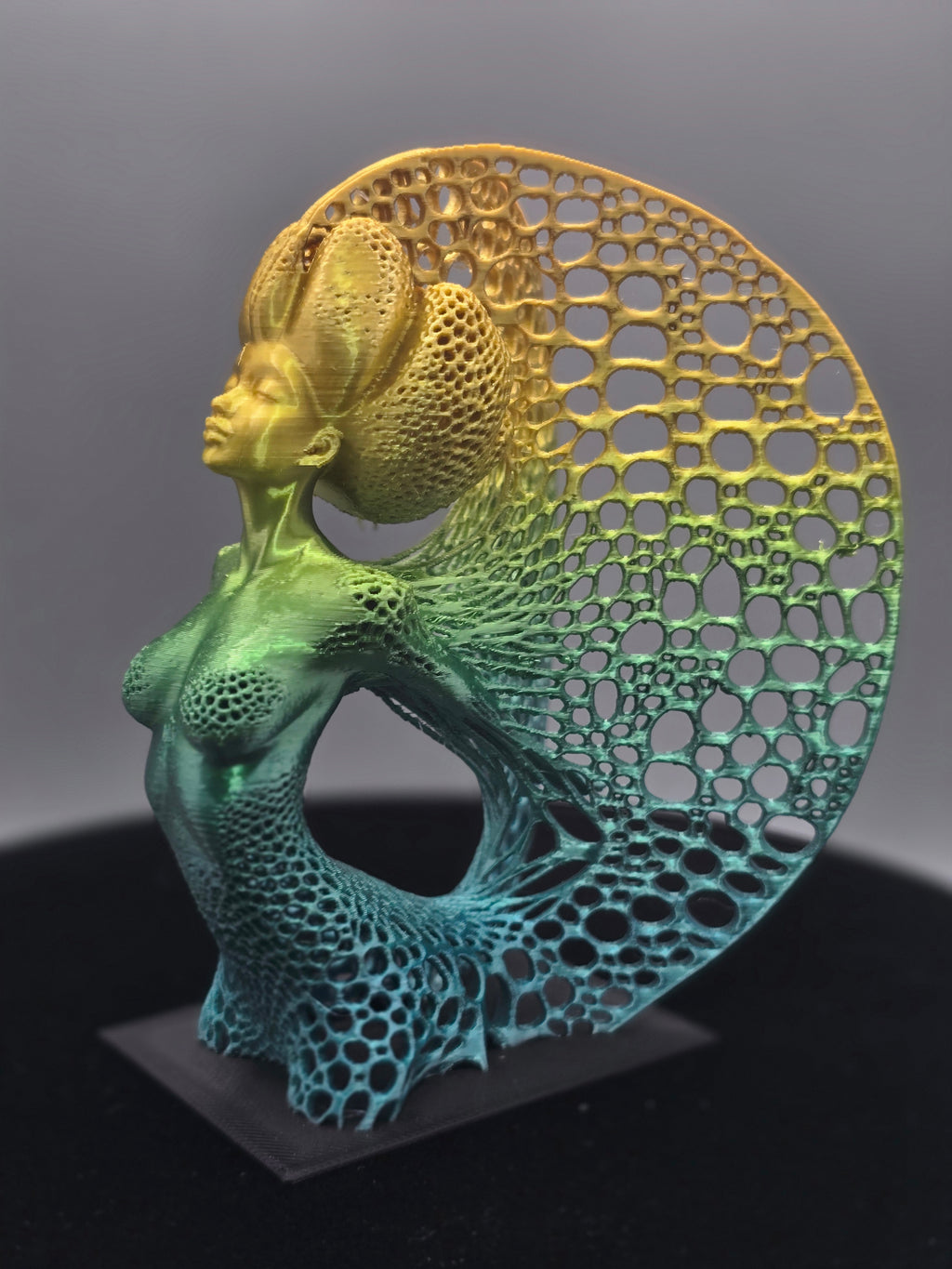Multicolored Woman Statue With Wings